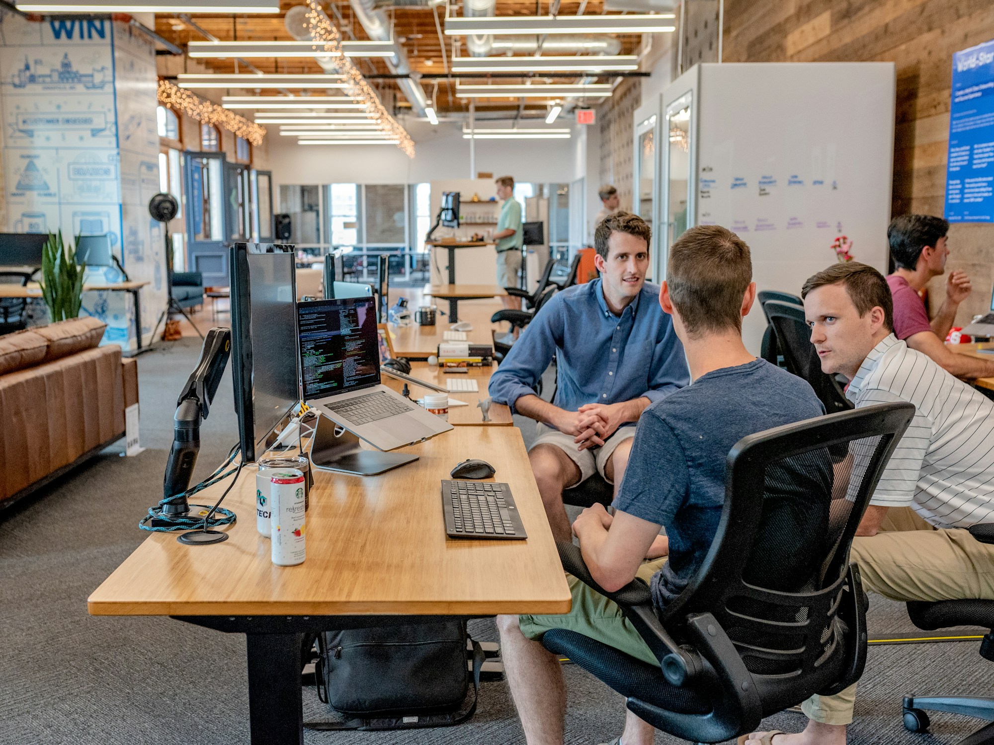 A technology team collaborating in an open workspace